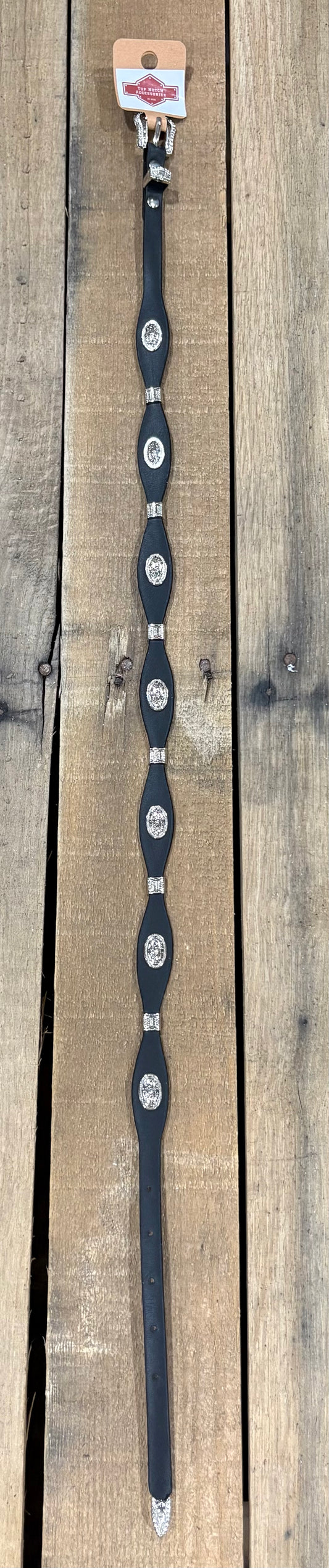 Black western leather hat band with a Longhorn concho separated by Silver bands. 