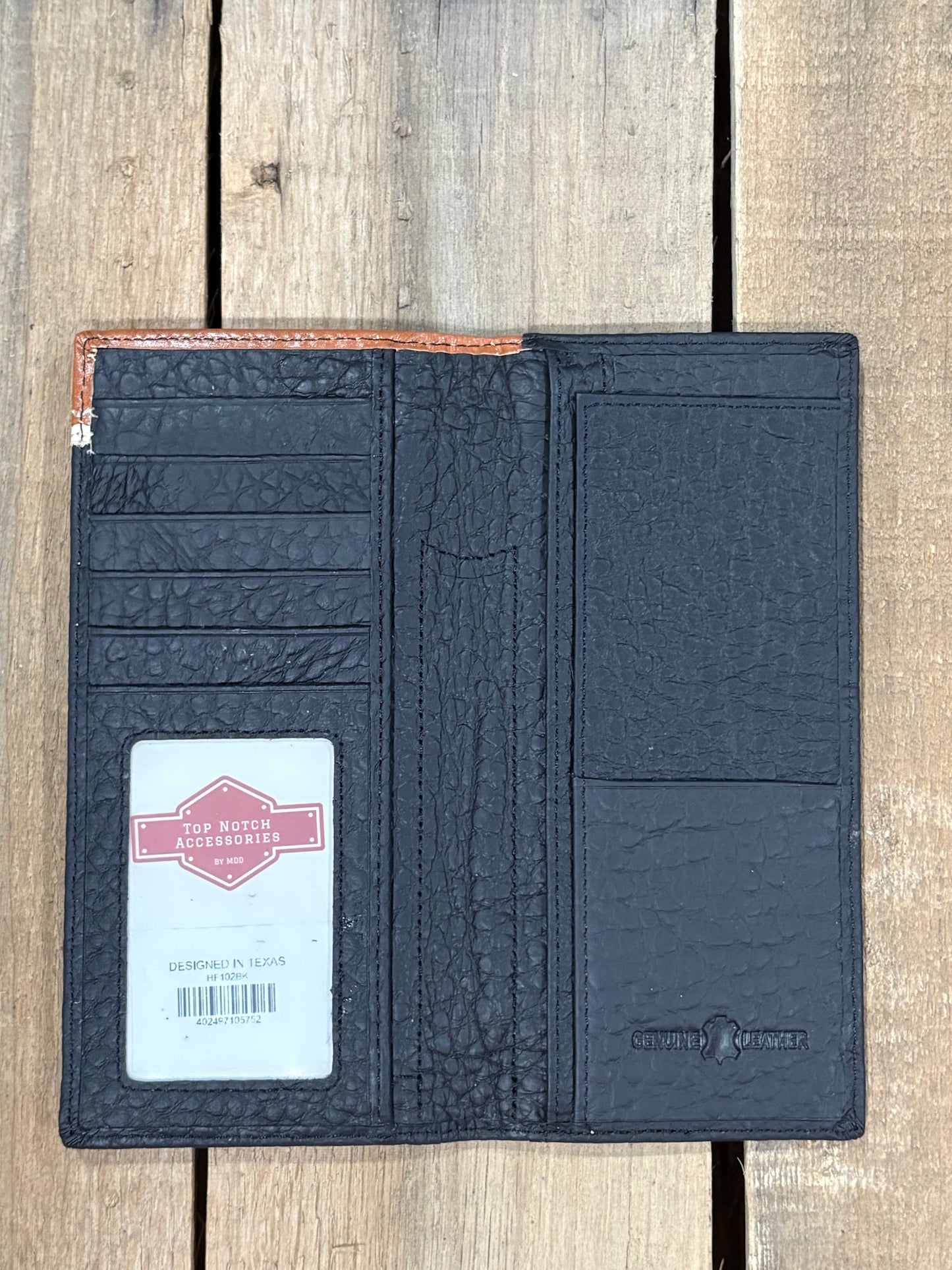 Black leather checkbook wallet. Inside view showing ID window, and multiple card and cash slots. 