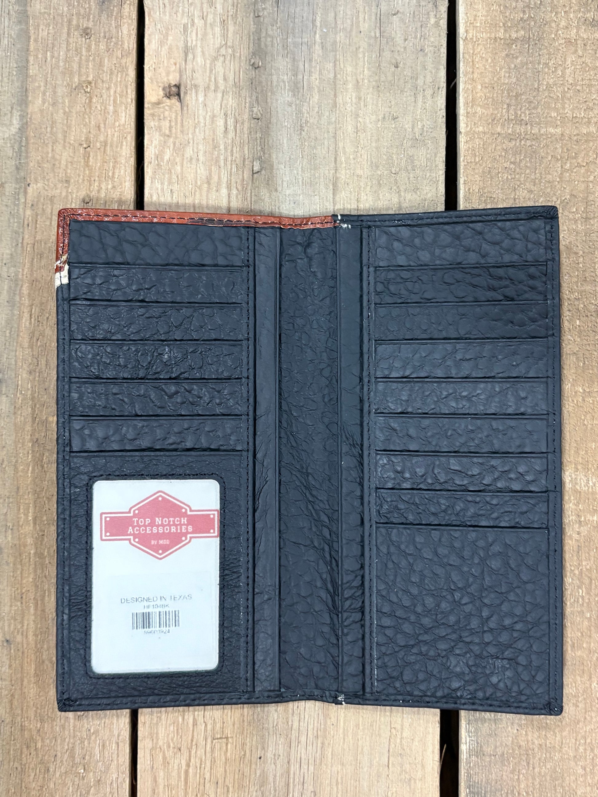 Black leather checkbook wallet. Inside view showing ID window, and multiple card and cash slots. 
