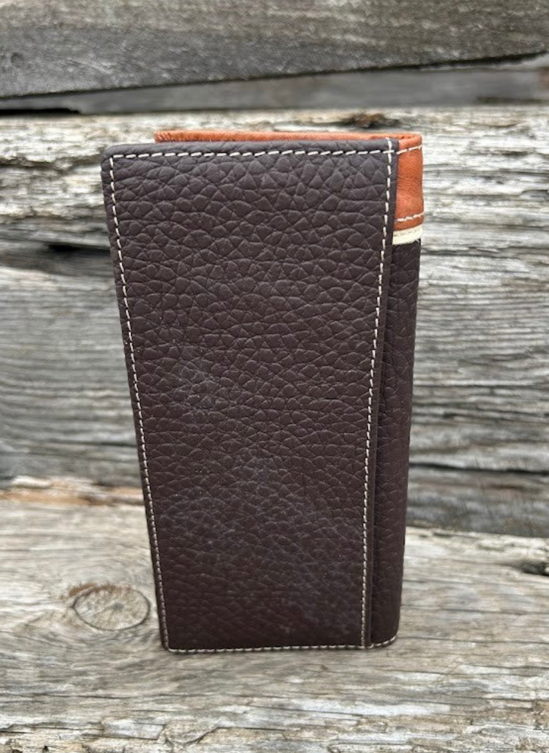 Coffee Brown leather wallet back view on a wooden surface