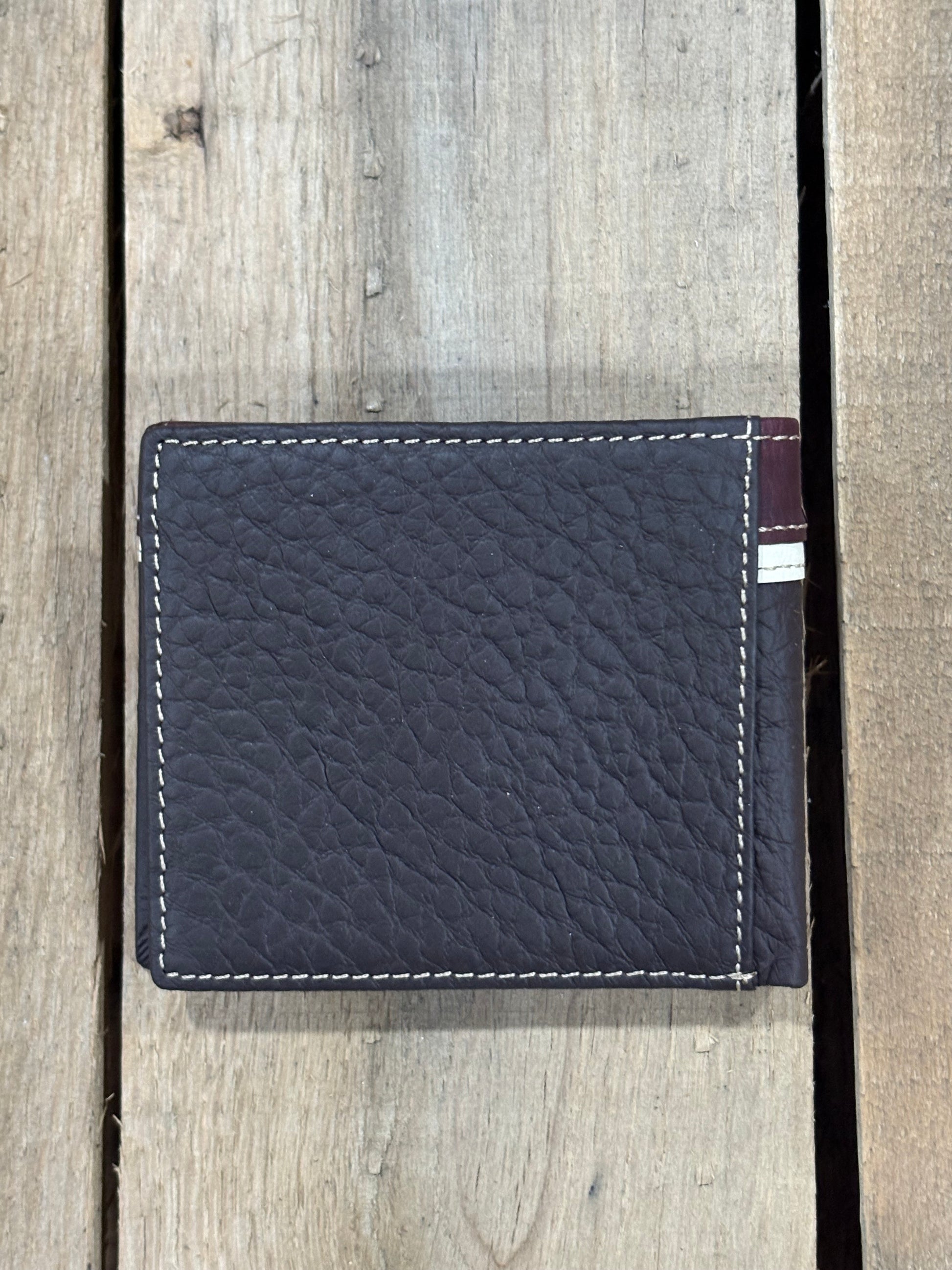 Coffee Brown leather cardholder with white stitching on a wooden surface