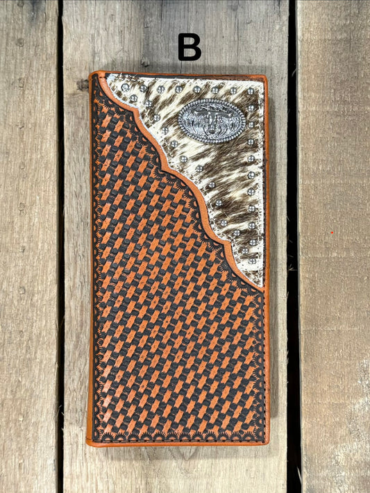Leather wallet with basketweave pattern and white hair-on corner with Longhorn concho on a wooden surface