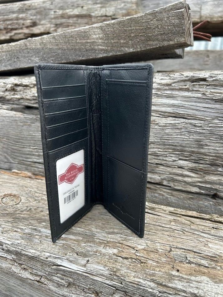 Black leather wallet with a visible brand label on a wooden surface