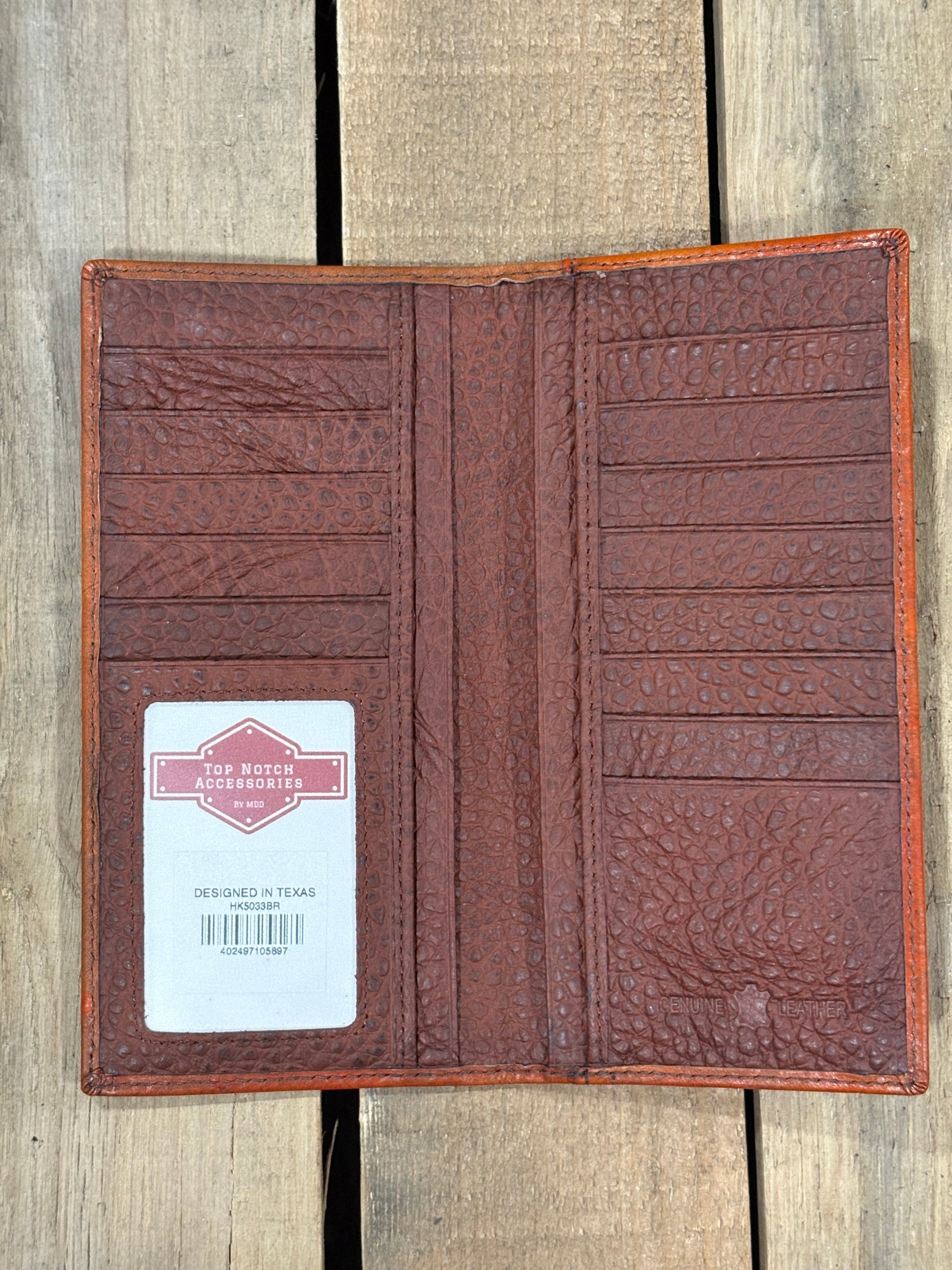 Brown leather wallet with a card holder on a wooden surface