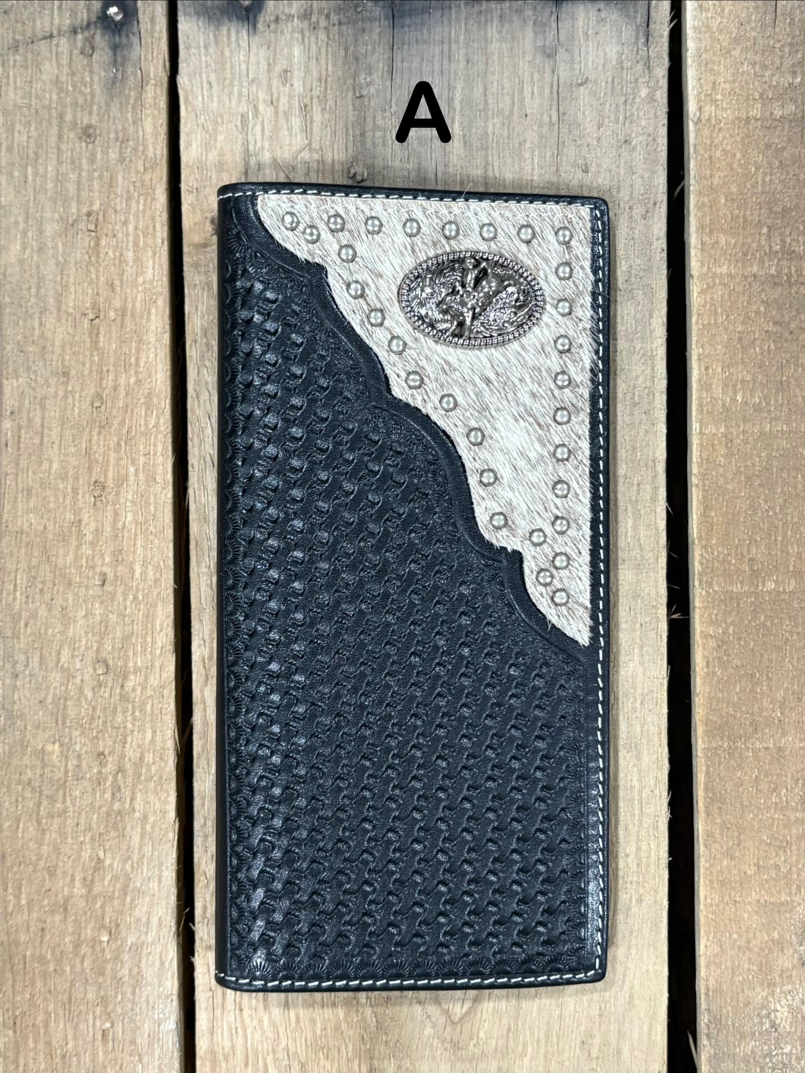 Black basketweave leather Tall wallet with a Bull Rider Concho on top right corner on top of Hair-On cowhide with Silver studs. Front View 
