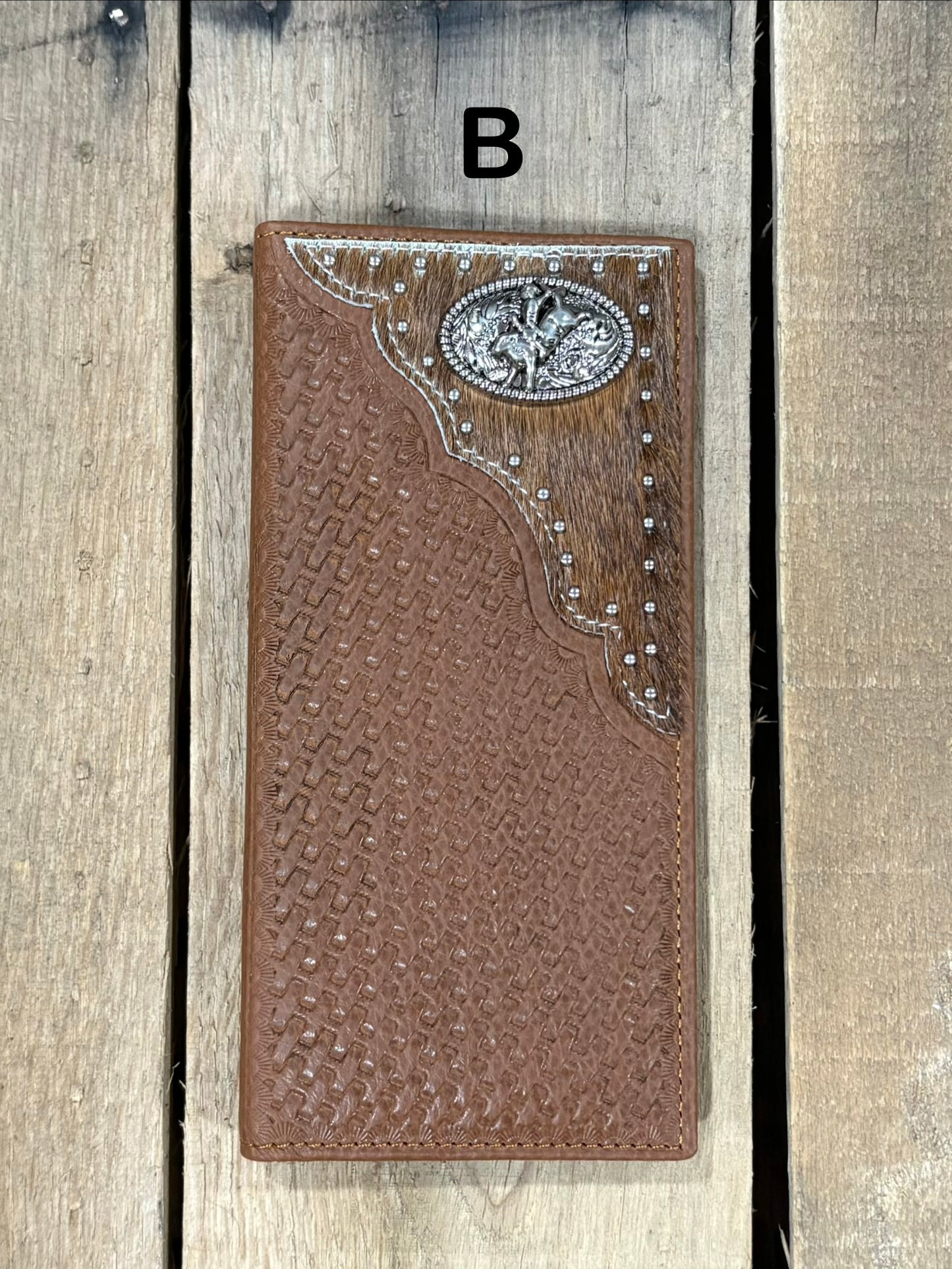 Brown basketweave leather Tall wallet with a Bull Rider Concho on top right corner on top of Hair-On cowhide with Silver studs. Front View 