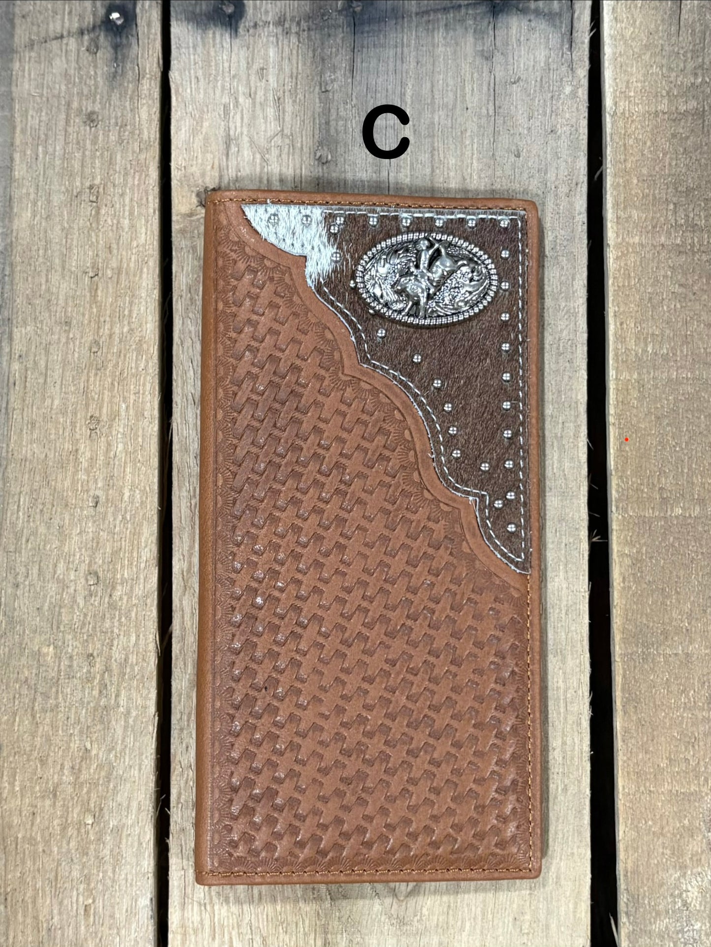 Brown basketweave leather Tall wallet with a Bull Rider Concho on top right corner on top of Hair-On cowhide with Silver studs. Front View 