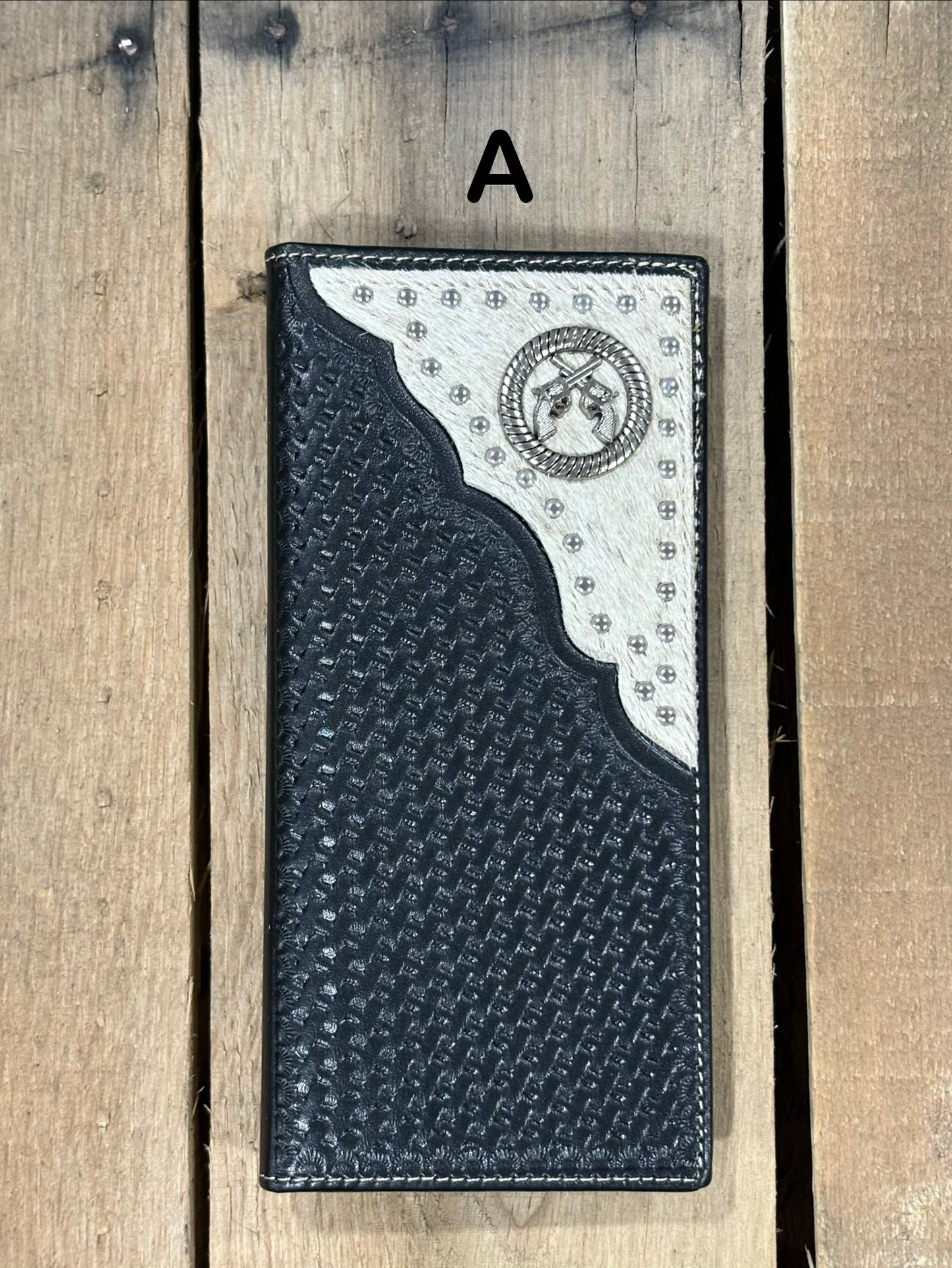 Black basketweave leather Tall wallet with a dueling pistols Concho on top right corner on top of Hair-On cowhide with Silver studs. Front View 