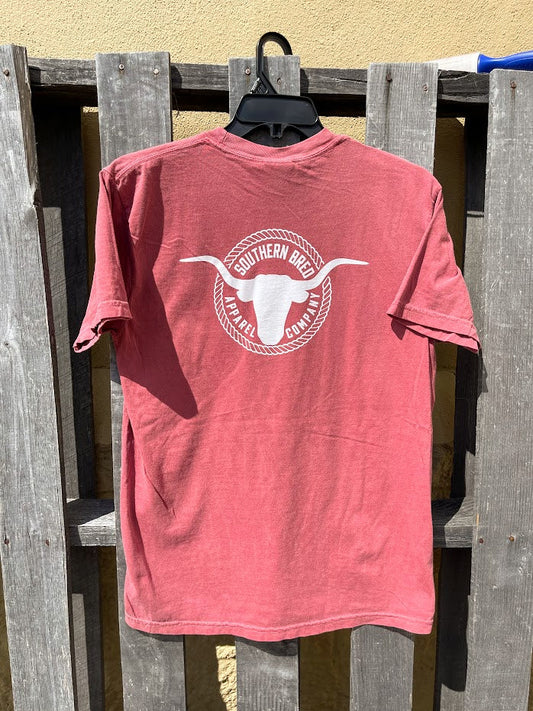 Brick t-shirt with a white logo on a wooden fence