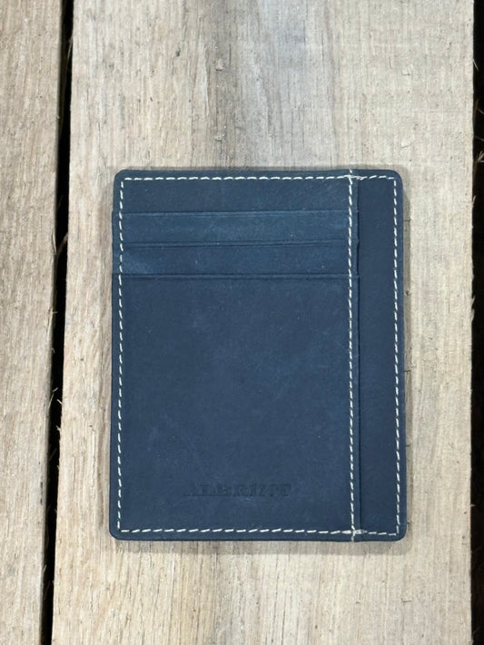 Black leather cardholder with white stitching on a wooden surface