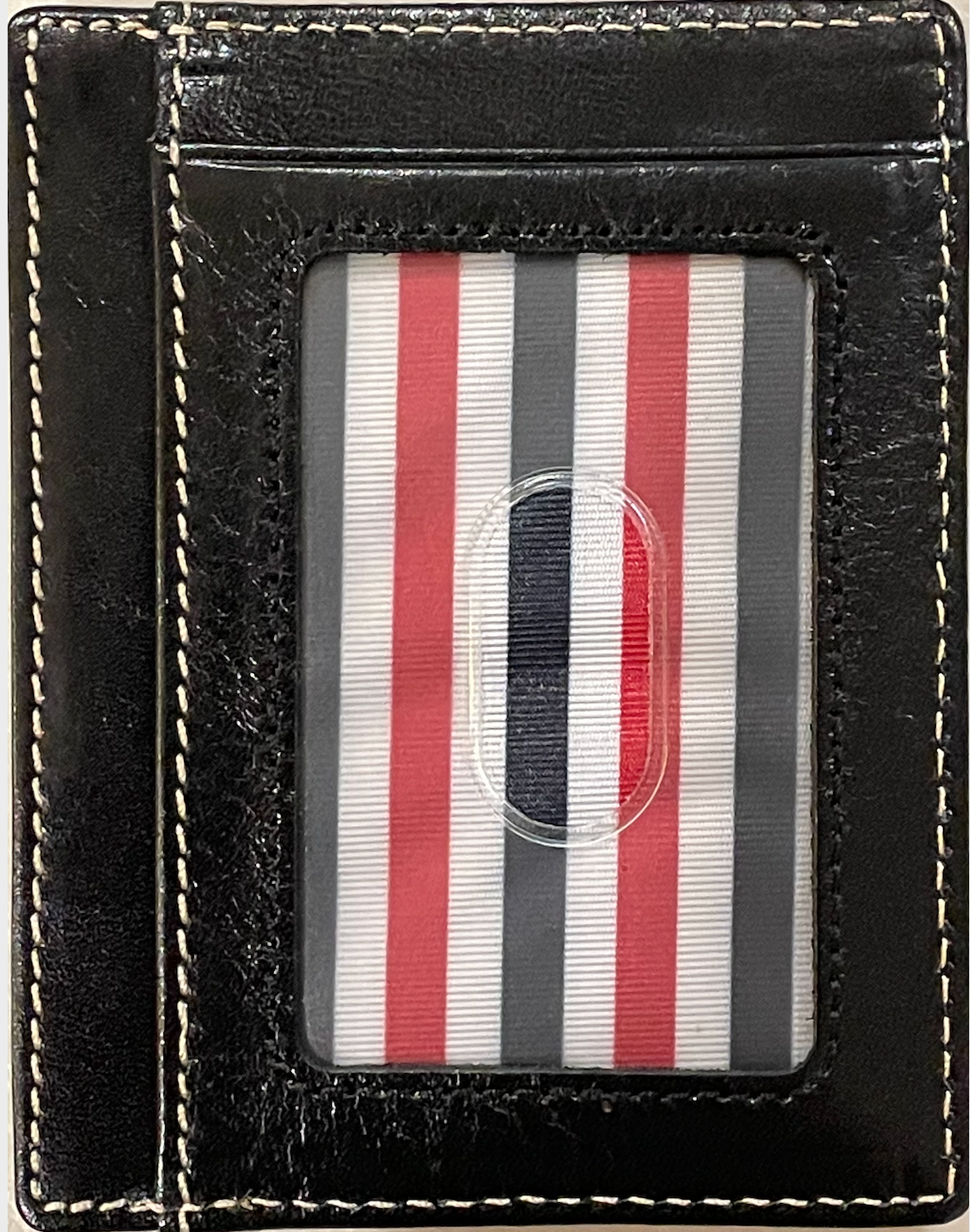 A black full grain leather front pocket wallet. ID Slot Window.