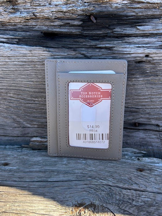 Gray leather wallet with a label on a wooden surface