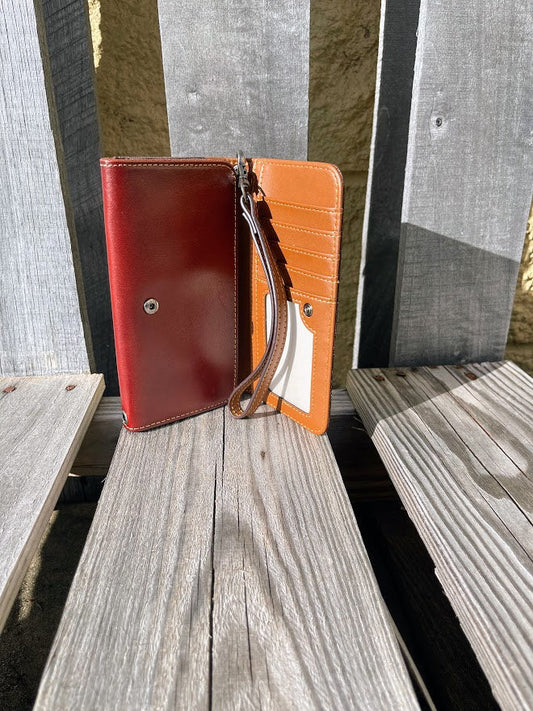 Brown tooled leather phone case wallet with Beige inlay.  Inside view showing ID window and multiple card slots. 