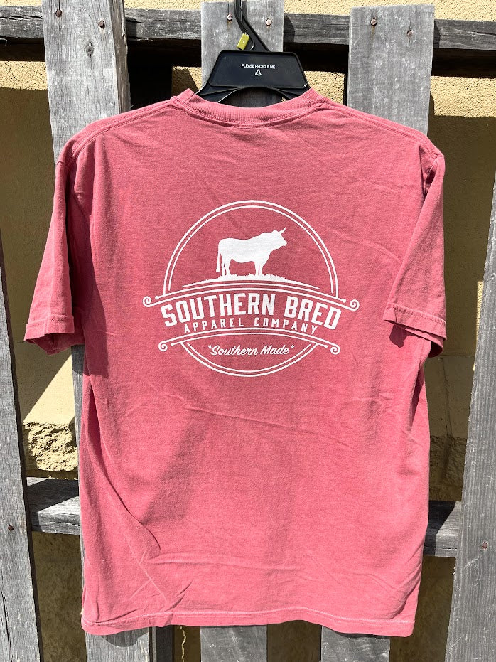 Brick t-shirt with 'Southern Bred Apparel Company' White logo on a wooden background